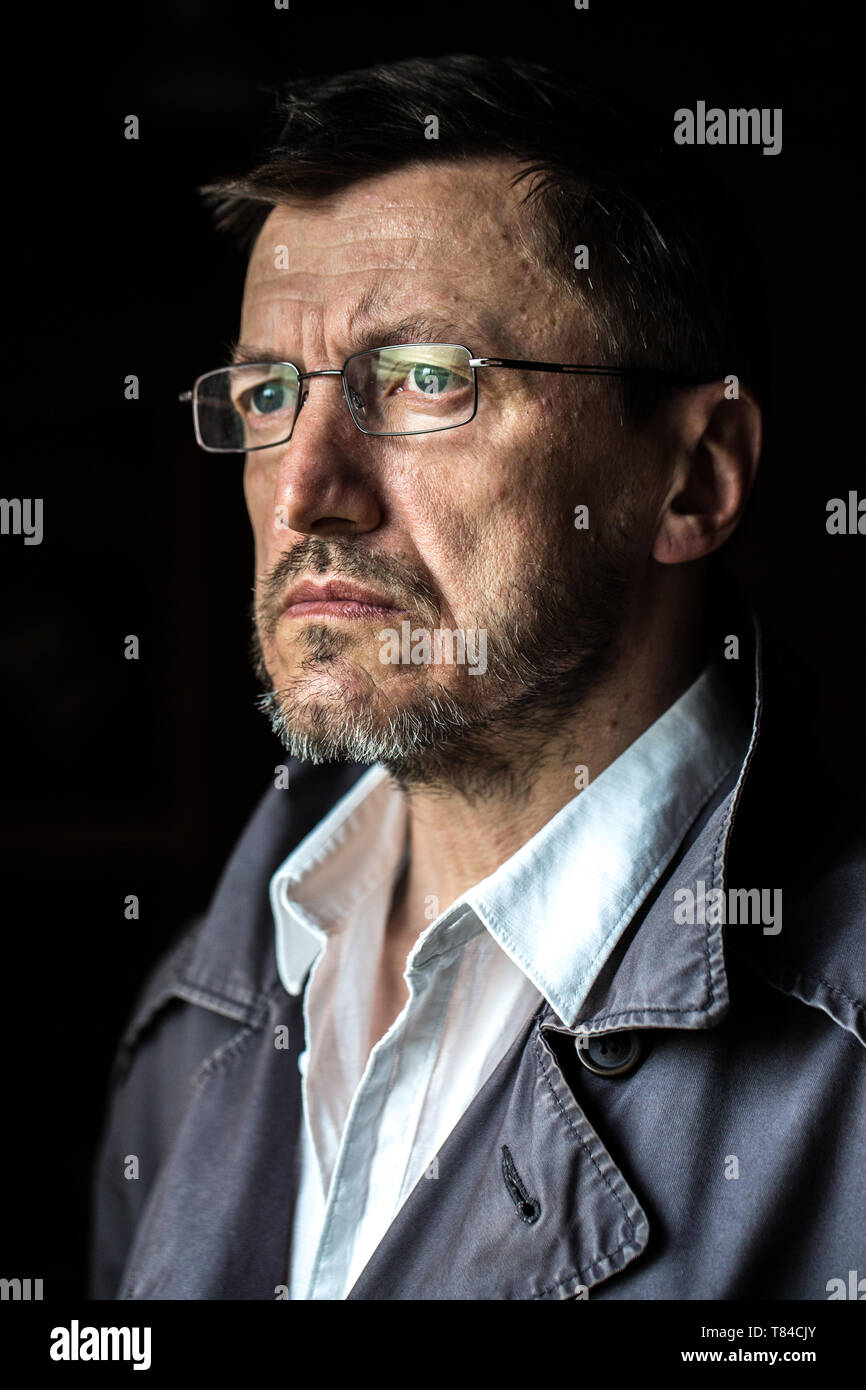 Close up portrait of senior man wearing glasses looking away. Stock Photo