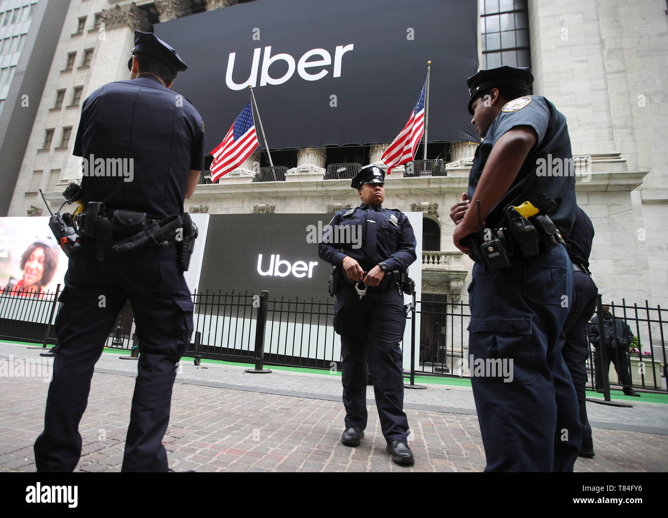 New York, USA. 10th May, 2019. Banners of Uber Technologies Inc. are seen hanging outside the New York Stock Exchange in New York, the United States, May 10, 2019. U.S. ride hailing company Uber Technologies Inc. began trading on the NYSE on Friday. Credit: Wang Ying/Xinhua/Alamy Live News Stock Photo