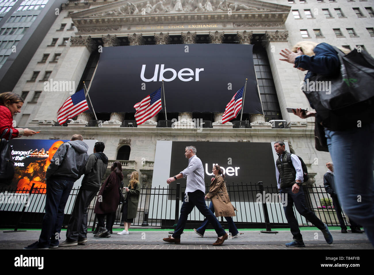 New York, USA. 10th May, 2019. Banners of Uber Technologies Inc. are seen hanging outside the New York Stock Exchange in New York, the United States, May 10, 2019. U.S. ride hailing company Uber Technologies Inc. began trading on the NYSE on Friday. Credit: Wang Ying/Xinhua/Alamy Live News Stock Photo
