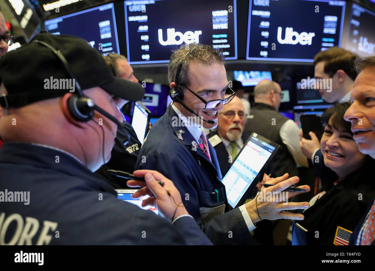 New York, USA. 10th May, 2019. Traders work at the New York Stock Exchange during the initial public offering (IPO) of Uber Technologies Inc., in New York, the United States, May 10, 2019. U.S. ride hailing company Uber Technologies Inc. began trading on the NYSE on Friday. Credit: Wang Ying/Xinhua/Alamy Live News Stock Photo