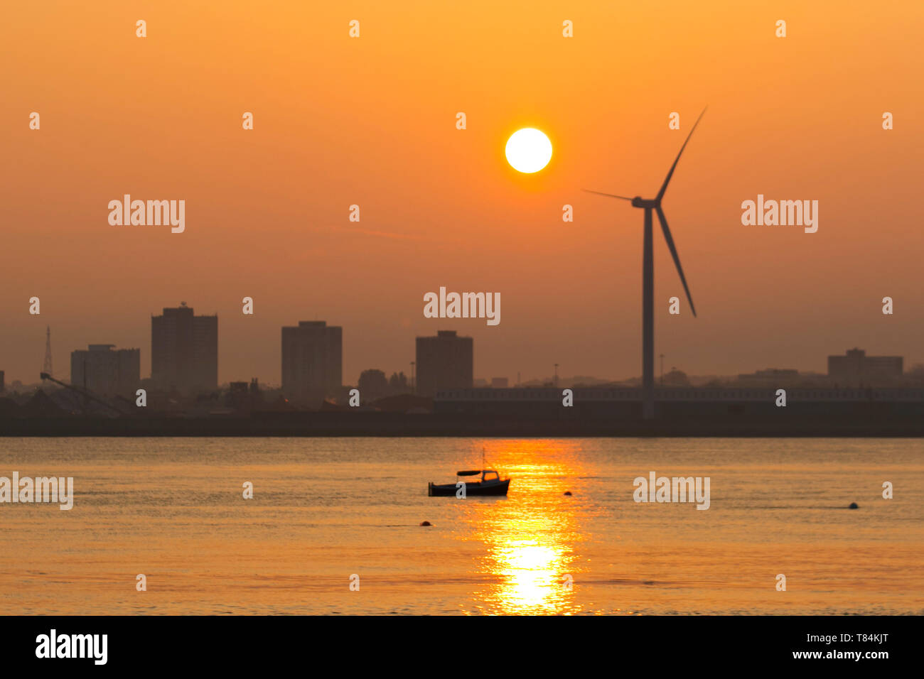 Liverpool, Merseyside. 11th May, 2019. UK Weather: Bright, Hazy start to the day as the sun rises over the River Mersey, docks and harbour. Credit: MediaWorldImages/Alamy Live News Stock Photo