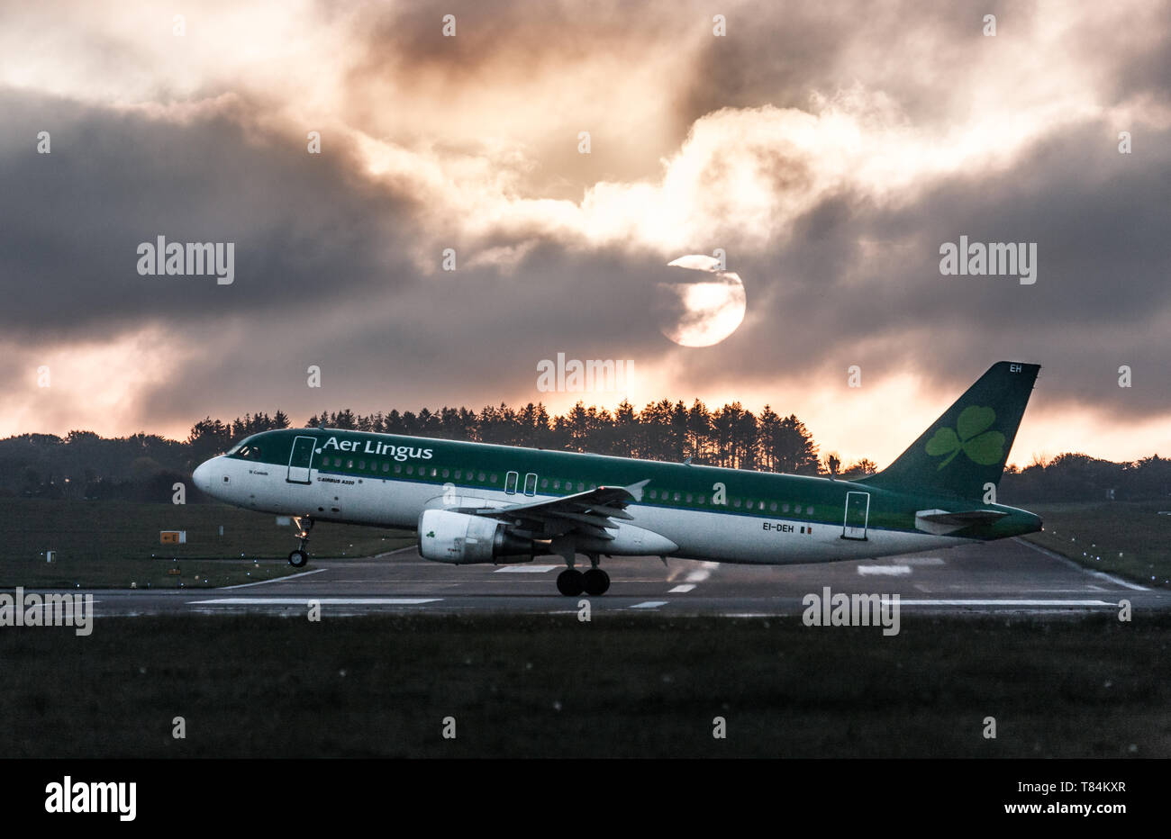 Cork Airport, Cork, Ireland. 11th May, 2019. Aer Lingus Airbus A320 takes off for Lanzarote just after sunrise from Cork Airport, Cork, Ireland. Credit: David Creedon/Alamy Live News Stock Photo