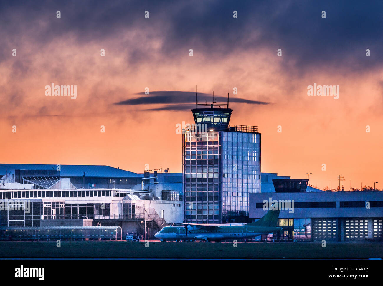 Cork Airport, Cork, Ireland. 11th May, 2019. A view of the  old control tower with an Aer Lingus Regional ART 72 parked on the apron about half an hour before sunrise at Cork Airport, Cork, Ireland. Credit: David Creedon/Alamy Live News Stock Photo