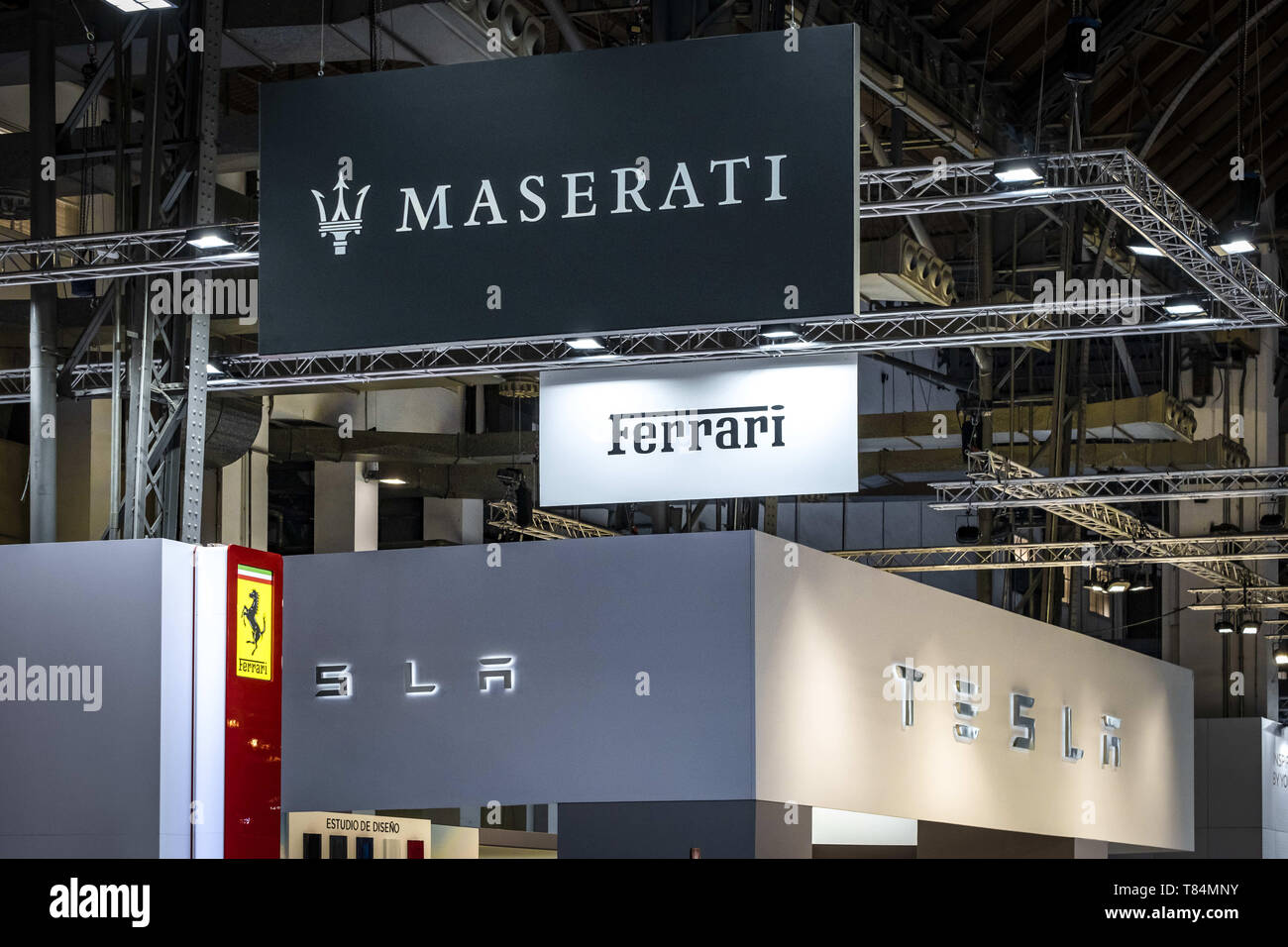 May 10, 2019 - Barcelona, Catalonia, Spain - The brand logos of Maserati, Ferrari and Tesla seen during the event..The Automobile Barcelona trade fair celebrates 100 years. The event takes place from 9 to 19 May at the MontjuÃ¯c fairgrounds. With more than 150,000 square meters and 45 brands, the fair shows the latest vehicle models as well as the latest technologies applied to driving. (Credit Image: © Paco Freire/SOPA Images via ZUMA Wire) Stock Photo