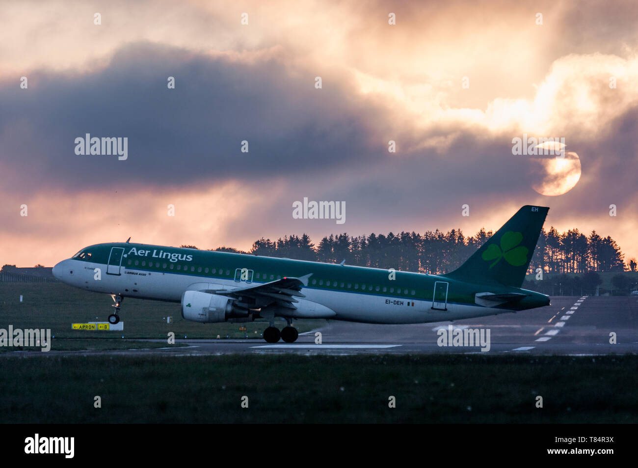 Cork Airport, Cork, Ireland. 11th May, 2019. Aer Lingus Airbus A320 takes off for Lanzarote just after sunrise from Cork Airport, Cork, Ireland. Credit: David Creedon/Alamy Live News Stock Photo