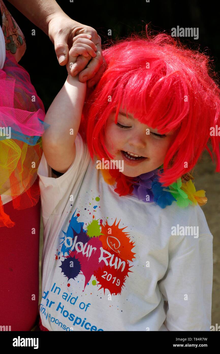 Weymouth, Dorset. 11th May 2019. The last ever Weldmar's Colour Run takes place at Weymouth to raise funds for the charity. Participants have fun getting covered in brightly coloured  powder paint. Credit: Carolyn Jenkins/Alamy Live News Stock Photo