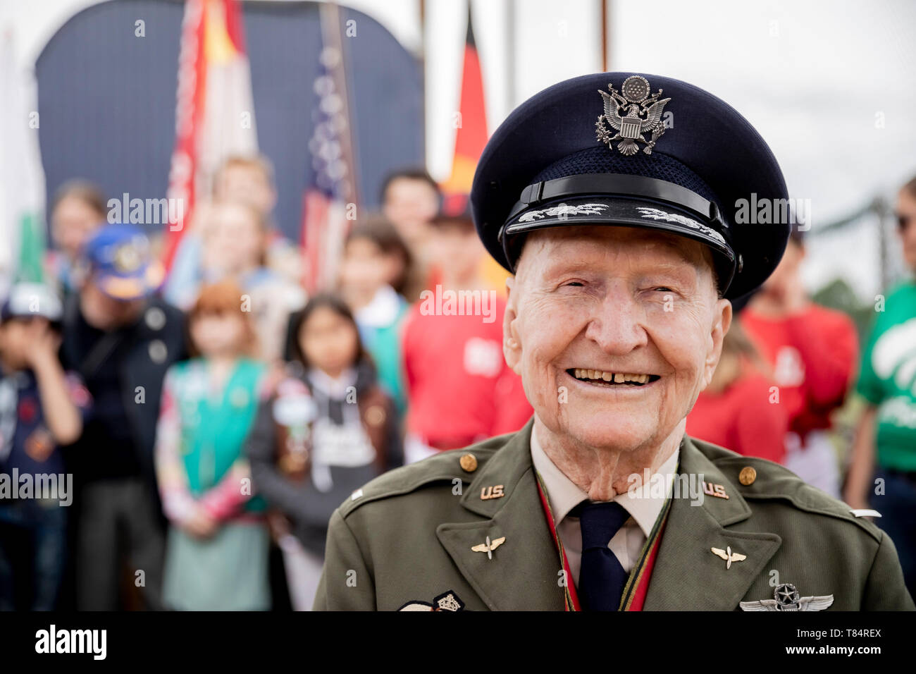 Berlin, Germany. 11th May, 2019. Gail Halvorsen, former airlift pilot of the 'Raisin Bomber', sits on the baseball and softball court on the Tempelhof field of the Berlin Braves sports club. The sports club names its new baseball and softball court after Halvorsen. Credit: Christoph Soeder/dpa/Alamy Live News Stock Photo