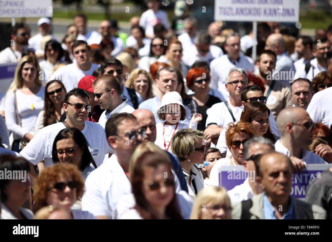 Sarajevo, Bosnia and Herzegovina. 11th May, 2019. Doctors take part in a protest rally in Sarajevo, Bosnia and Herzegovina, on May 11, 2019. Around 1,500 to 2,000 doctors from across Bosnia and Herzegovina protested in front of the parliament demanding the change of a law which will resolve their working status. Credit: Nedim Grabovica/Xinhua/Alamy Live News Stock Photo