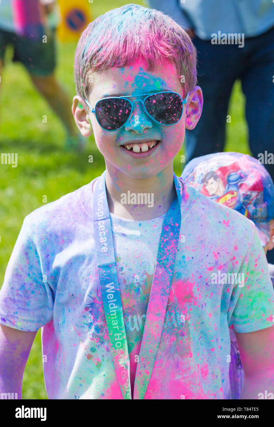 Weymouth, Dorset, UK. 11th May 2019. Weldmar's last ever Colour Run takes place at Weymouth to raise funds for the charity. Participants have fun getting covered in brightly coloured powder paint. Credit: Carolyn Jenkins/Alamy Live News Stock Photo