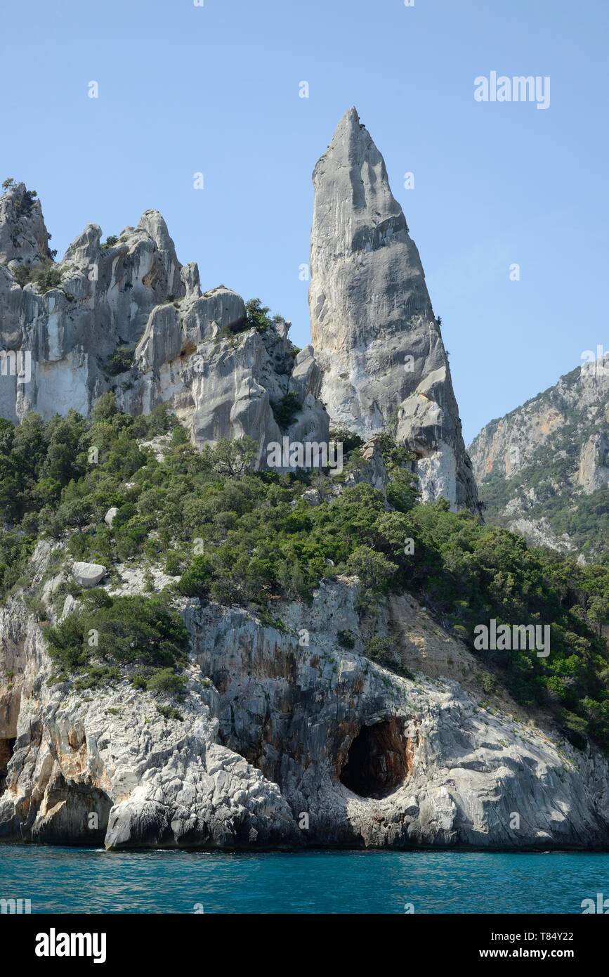 Monte Caroddi / Aguglia limestone rock pinnacle on the coast, Cala Goloritze, Gulf of Orosei, Gennargentu National Park, Baunei, Sardinia, Italy, June Stock Photo