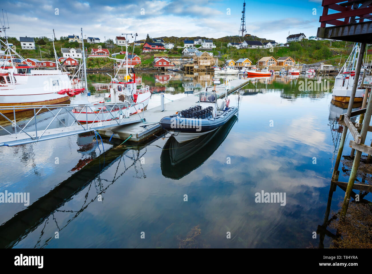 The view of the fisherman village Sorvagen with typical rorbu houses and boats in Lofoten islands, Norway. Stock Photo