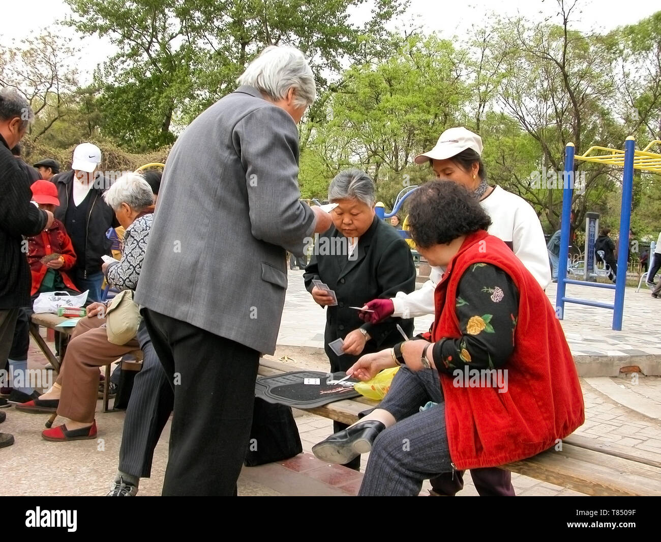 People playing cards in public garden, Beijing Stock Photo
