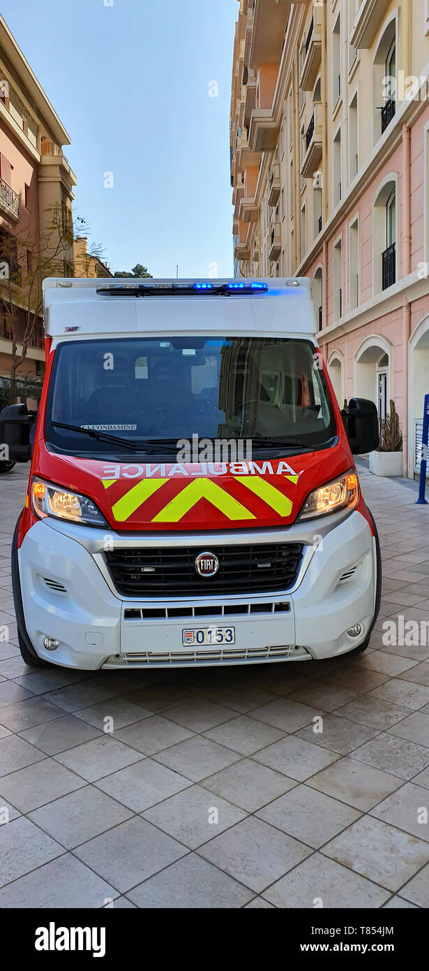 Monte-Carlo, Monaco - March 28,  French Red And White Fire Department Ambulance (Front View) Van Parked In The Street Of Monaco, With Lights, French R Stock Photo