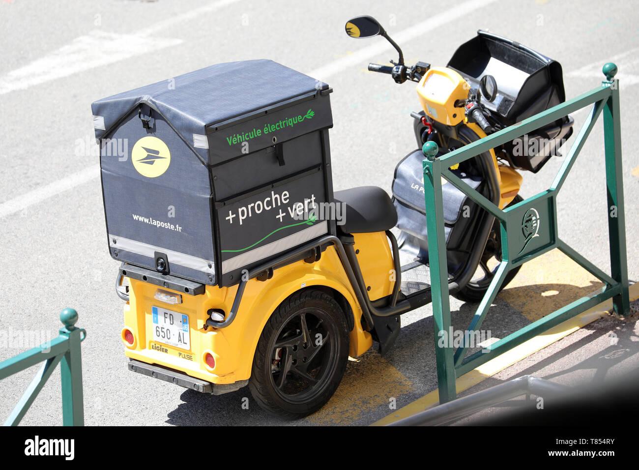 Roquebrune-Cap-Martin, France - April 30, 2019: Yellow Postal Delivery  Ligier Staby Pulse 3 Wheel Electric Scooter Parked In The Street. La Poste  Is A Stock Photo - Alamy