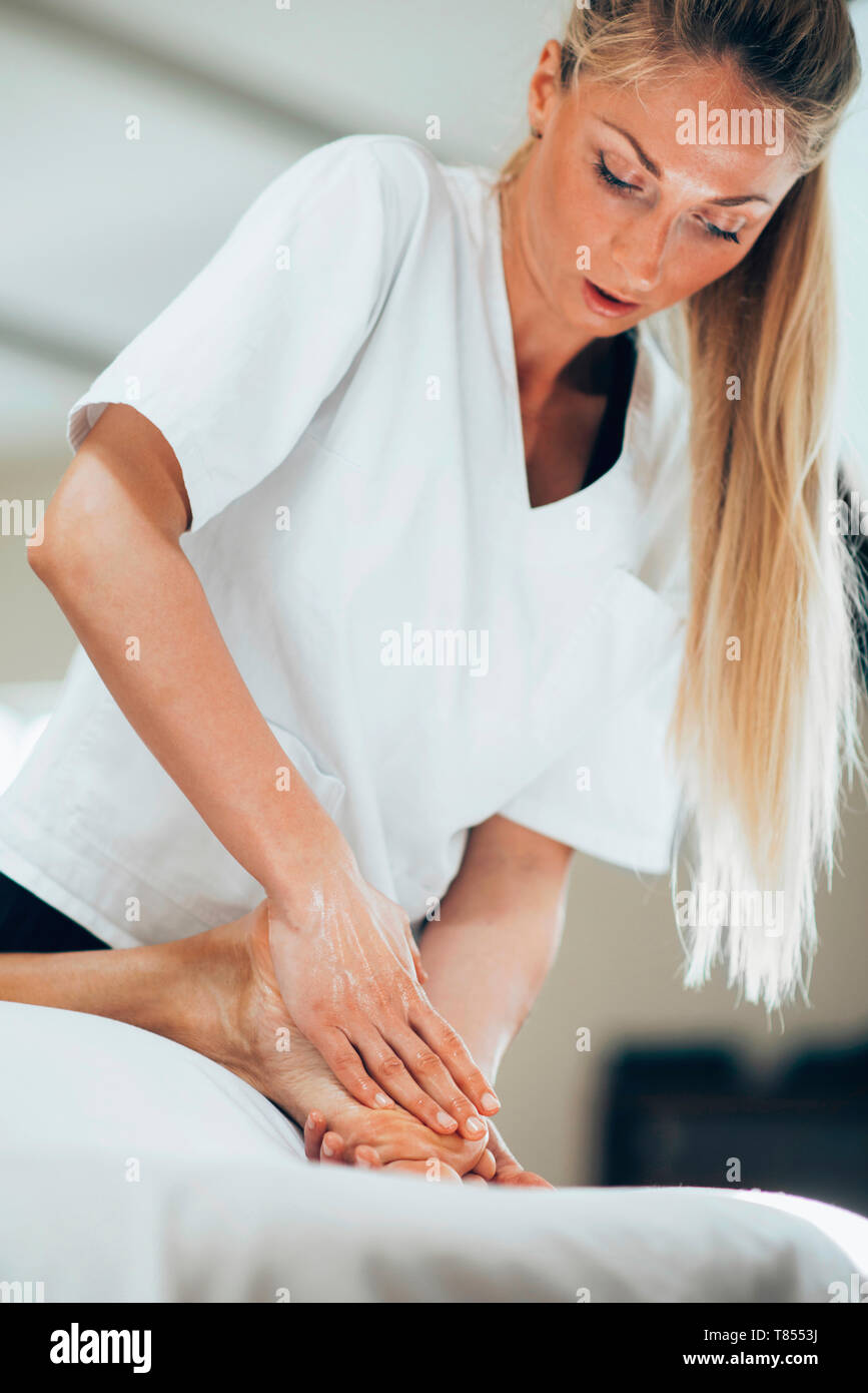 Male foot massage hires stock photography and images Alamy