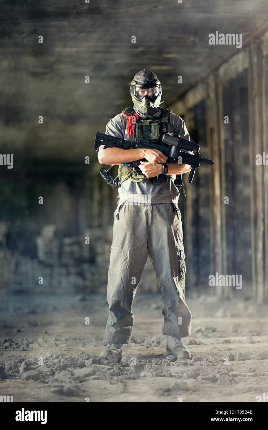 Paintball player posing inside of runs Stock Photo Alamy