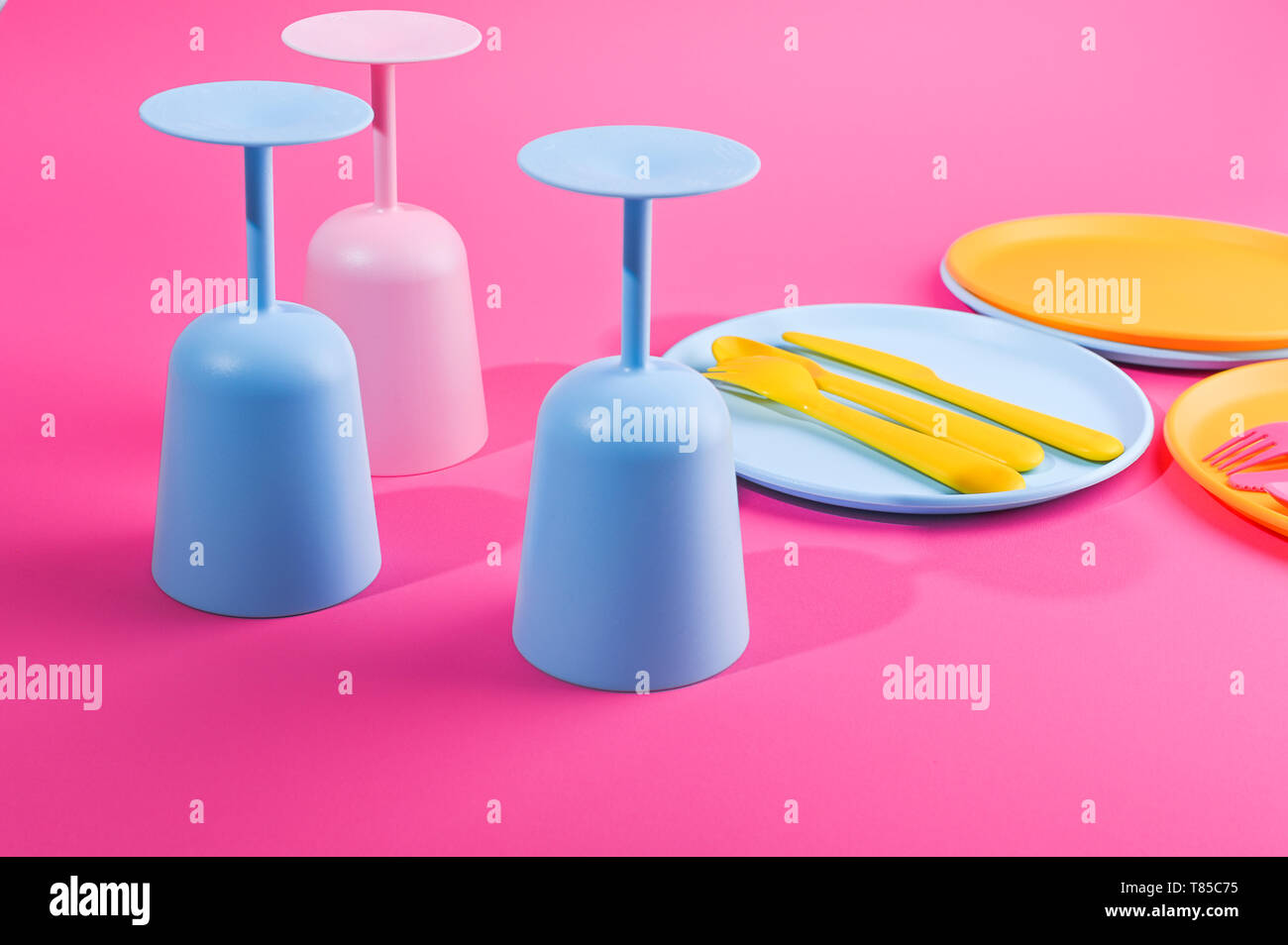 Blue plastic glasses and plates. Color dishes for a summer picnic. Top