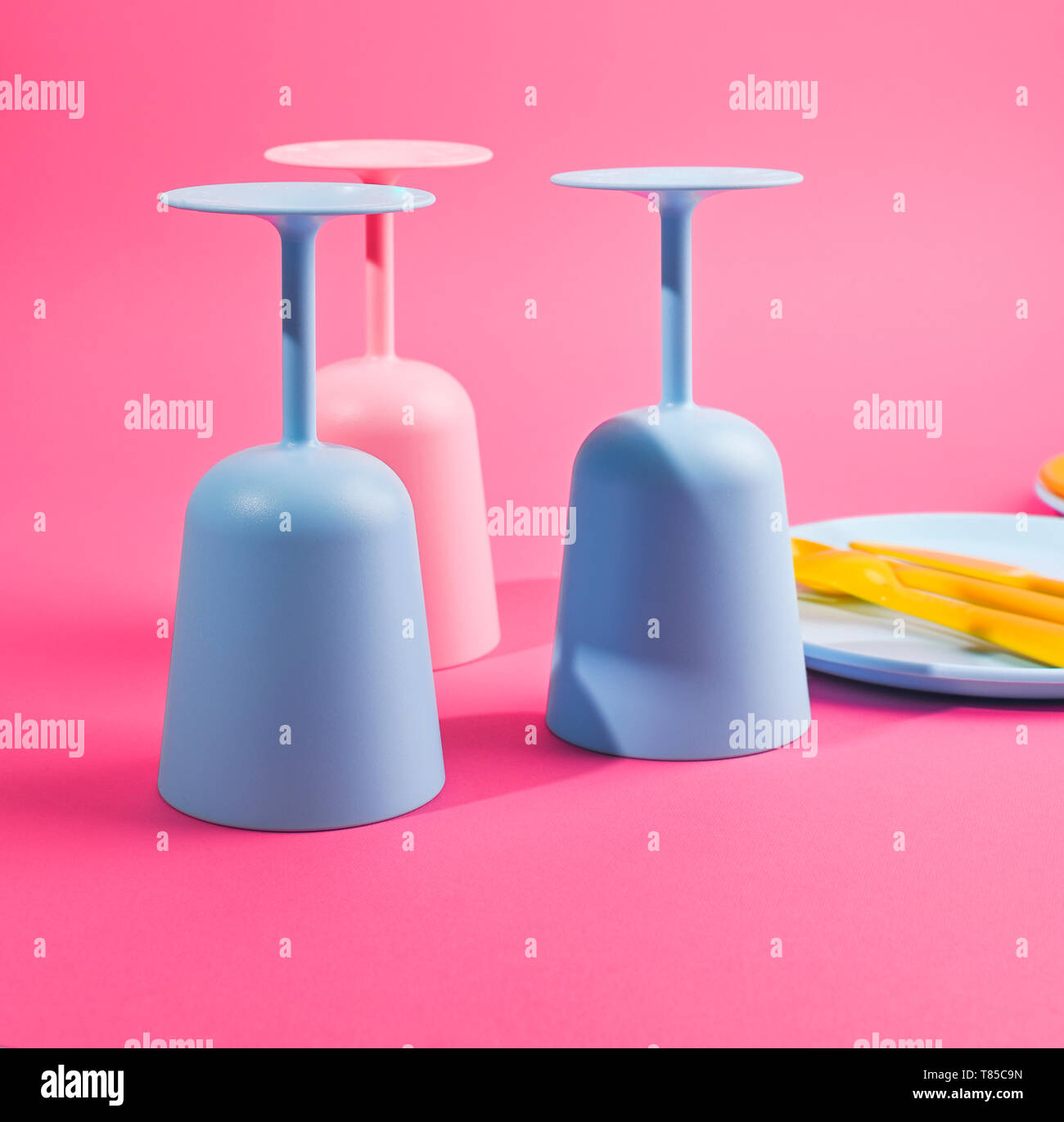 Blue plastic glasses and plates. Color dishes for a summer picnic. Top