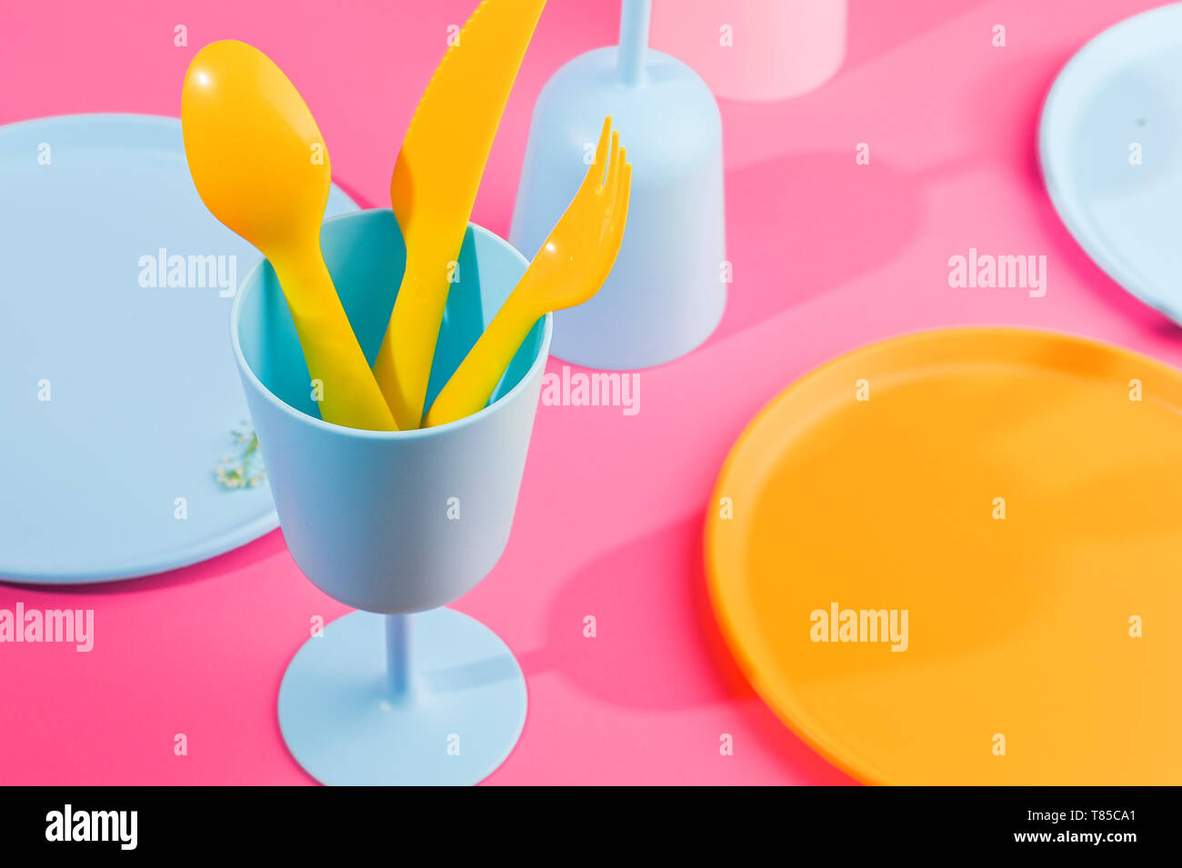 Blue plastic glasses and plates. Color dishes for a summer picnic. Top