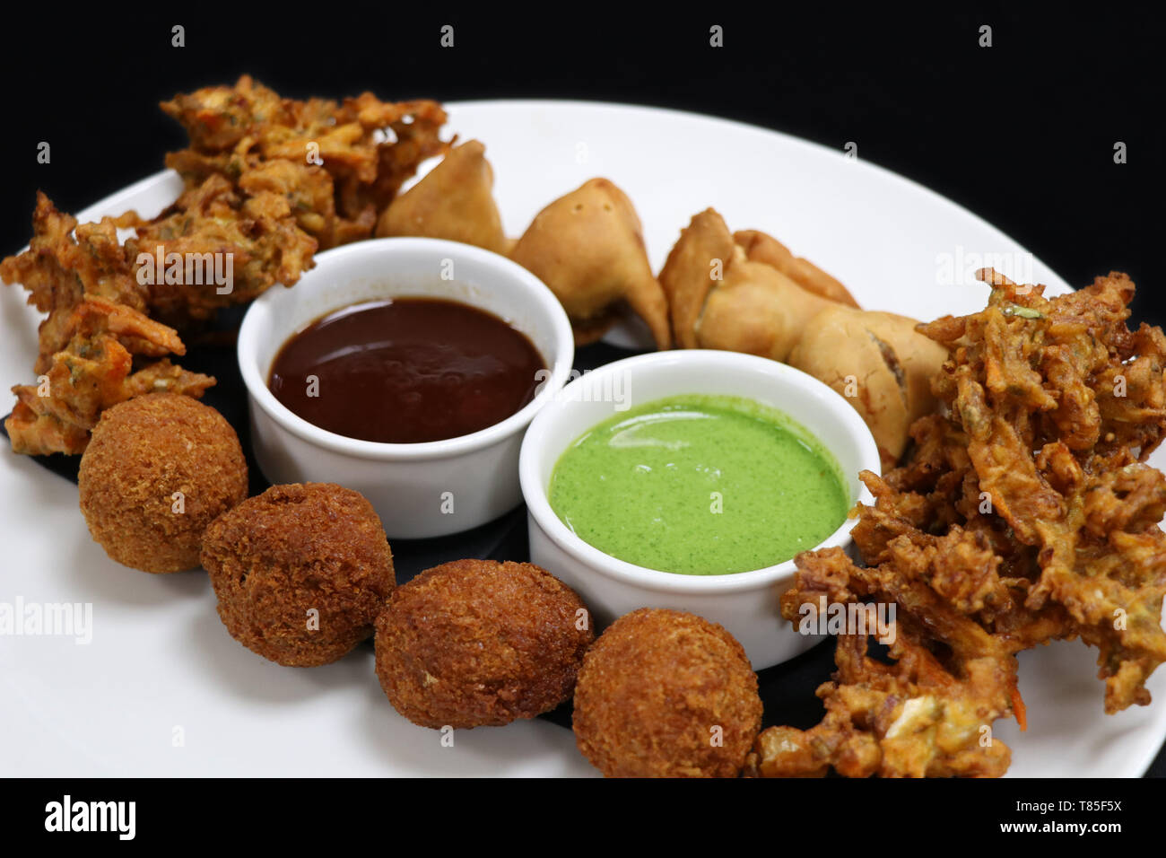 Indian snack pakora platter with mint and tamarind sauce Stock Photo