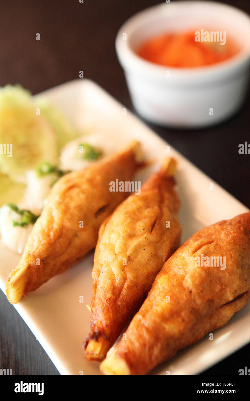 vietnam Food grill prawn rosted over on open sugar cane skewer Stock