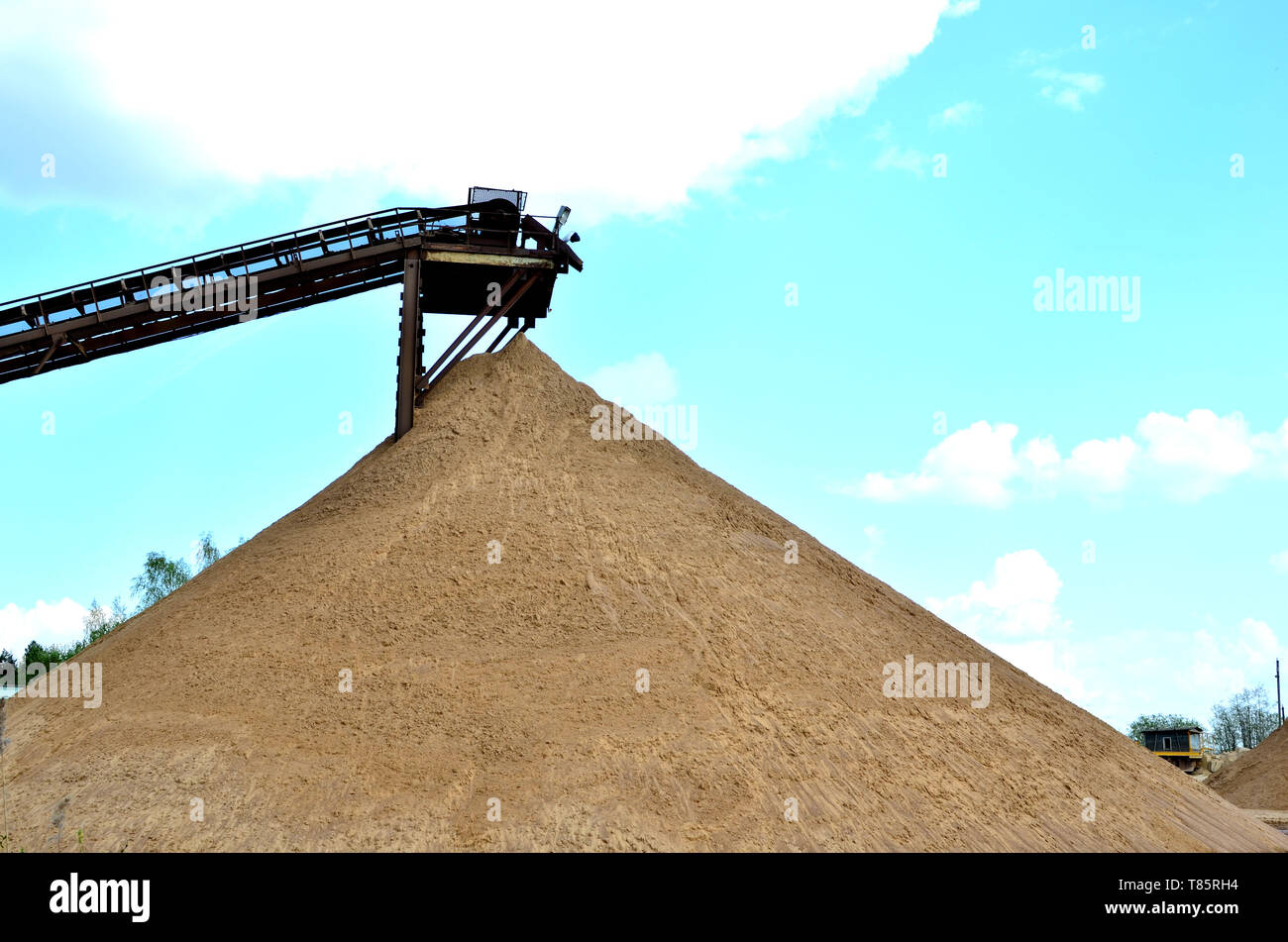 Sand Making Plant in mining quarry. Crushing factory, machines and equipment for crushing, grinding stone, sorting sand and bulk materials. Stock Photo