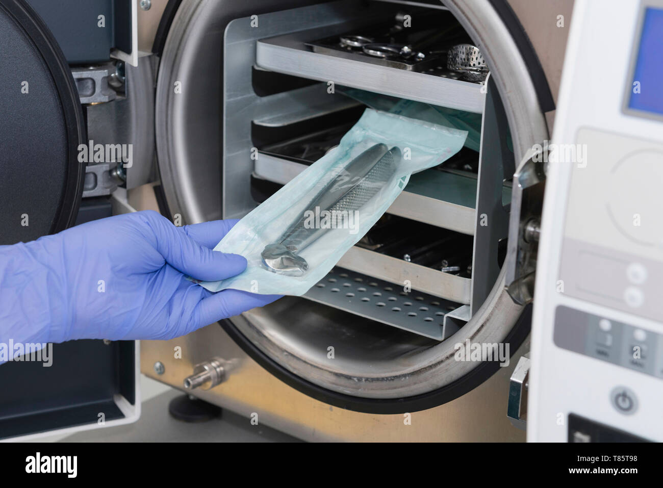 Sterilizing medical instruments in autoclave Stock Photo Alamy
