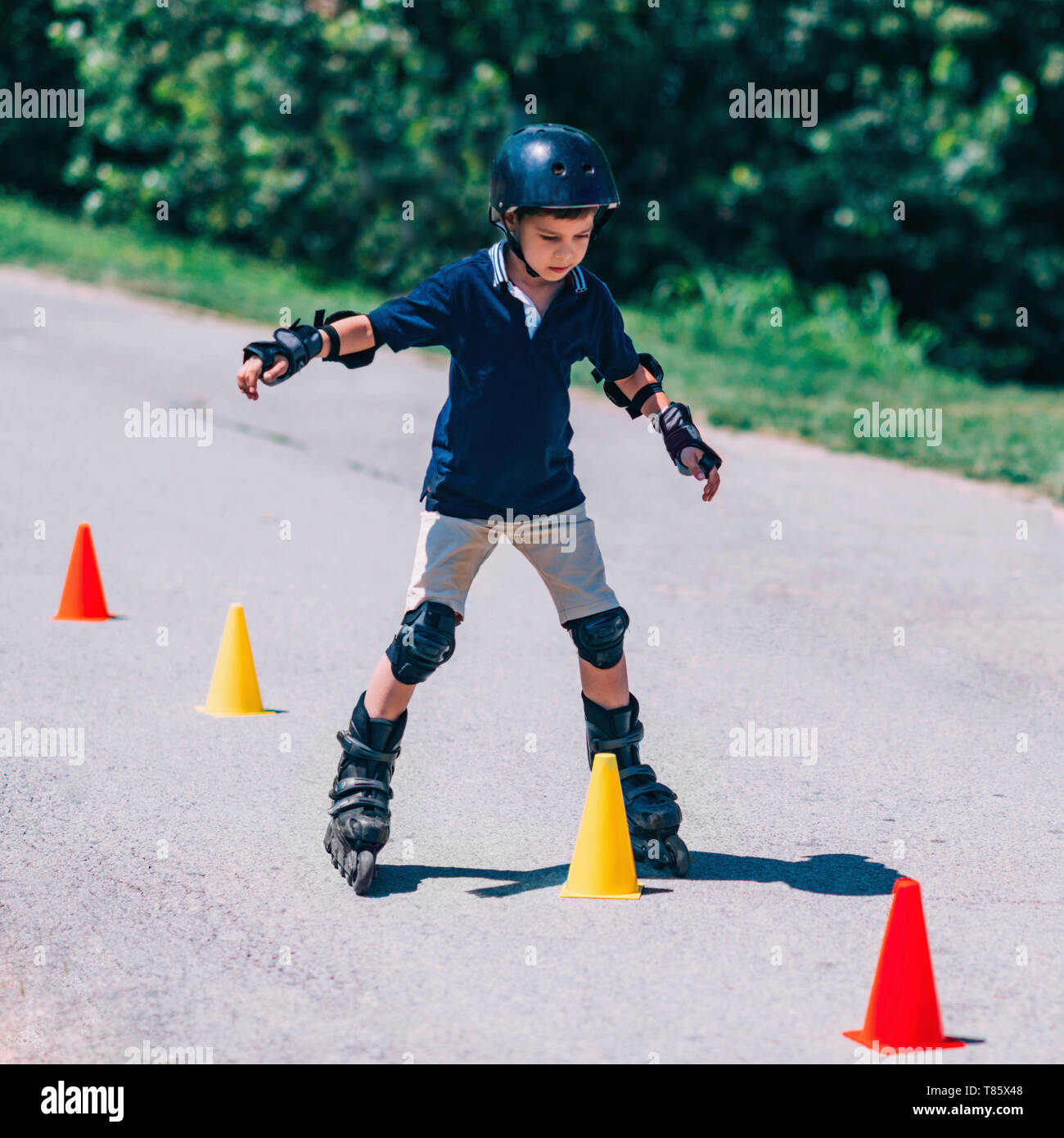 Boy learning to roller skate Stock Photo Alamy