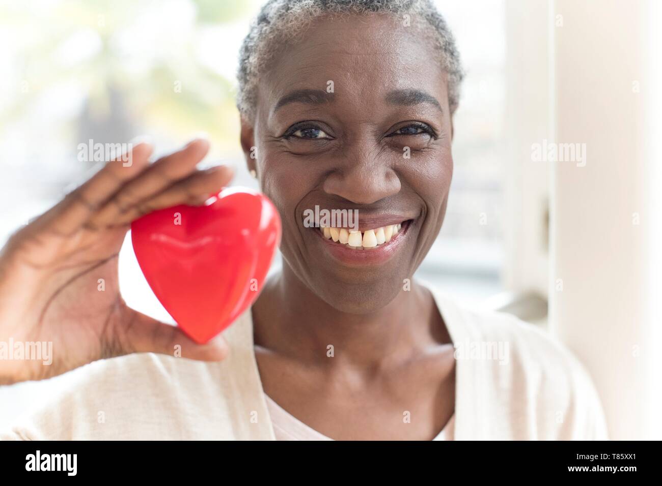 Woman holding heart shape Stock Photo