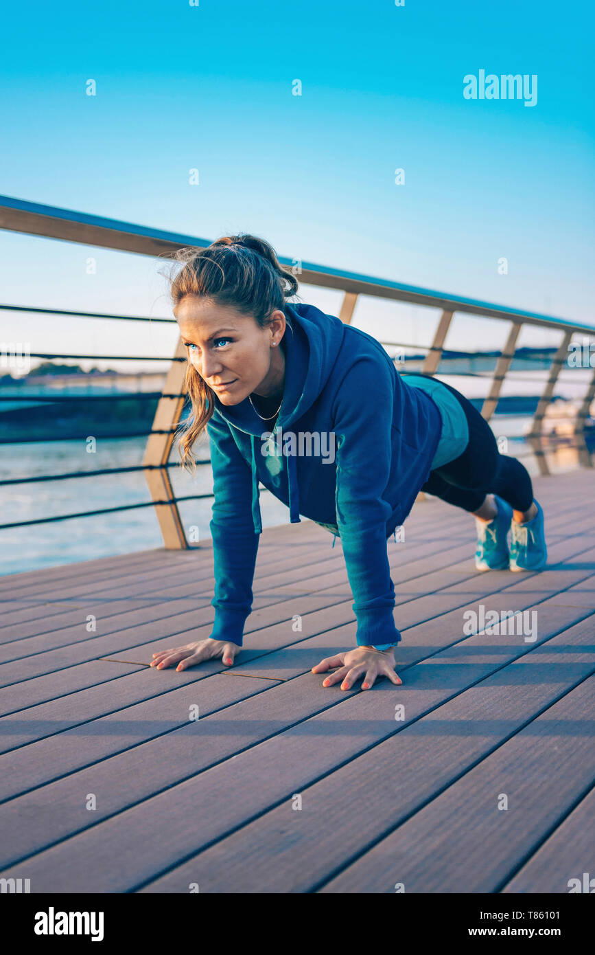 Woman exercising outside Stock Photo