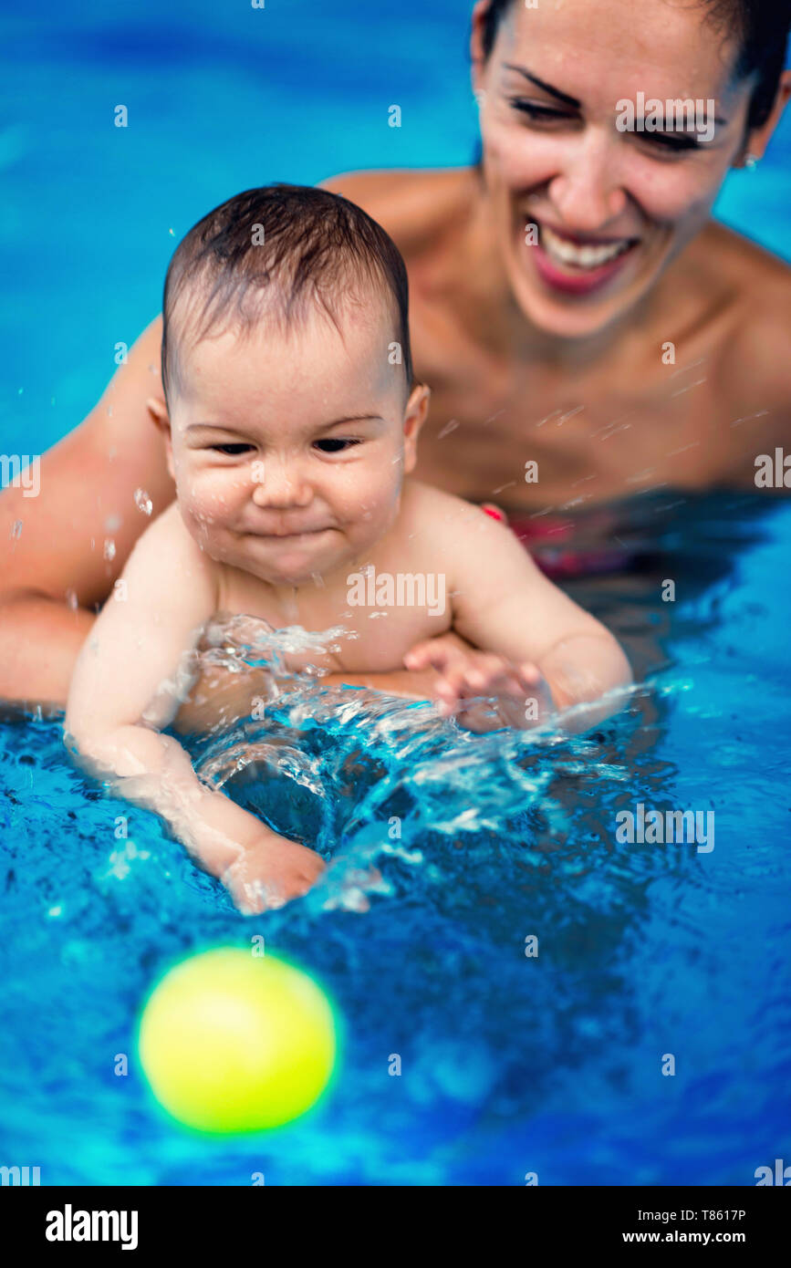 Baby boy and mother in swimming pool Stock Photo Alamy