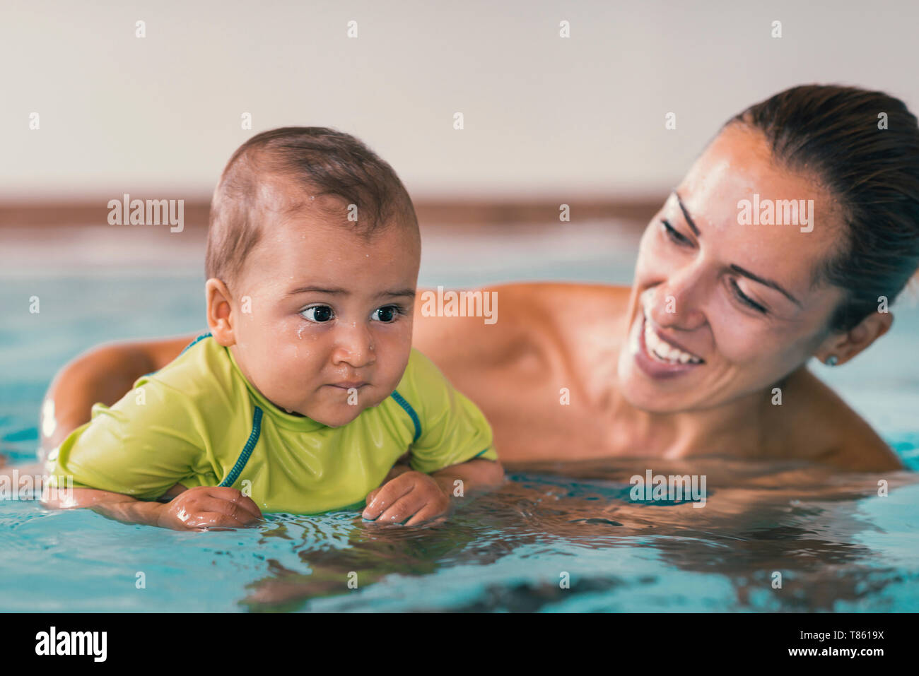 Baby boy and mother in swimming pool Stock Photo Alamy