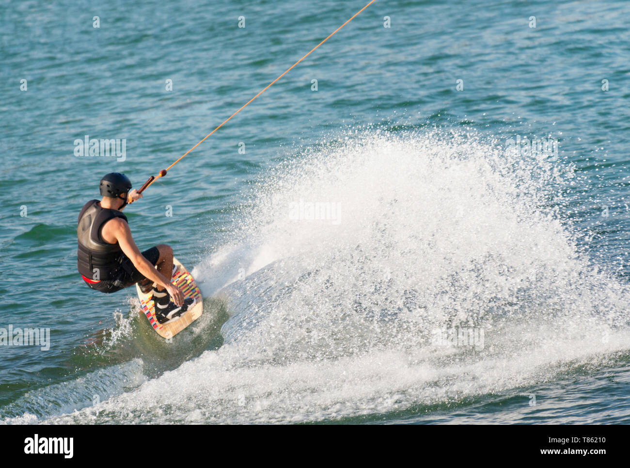 Young man wakeboarding Stock Photo