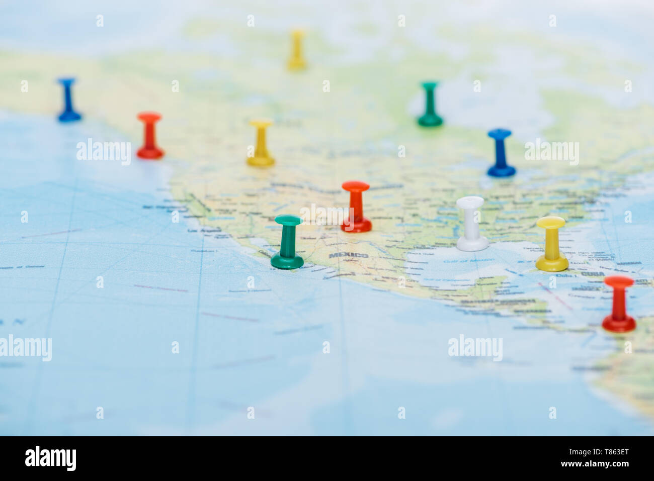 selective focus of colorful push pins on world map with copy space ...