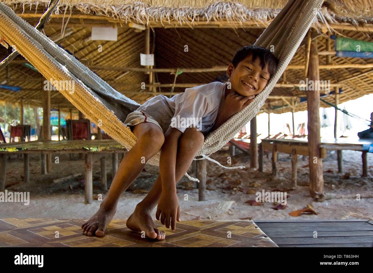 Cambodia, Sihanoukville or Preah Sihanouk, boy on a hammock Stock Photo