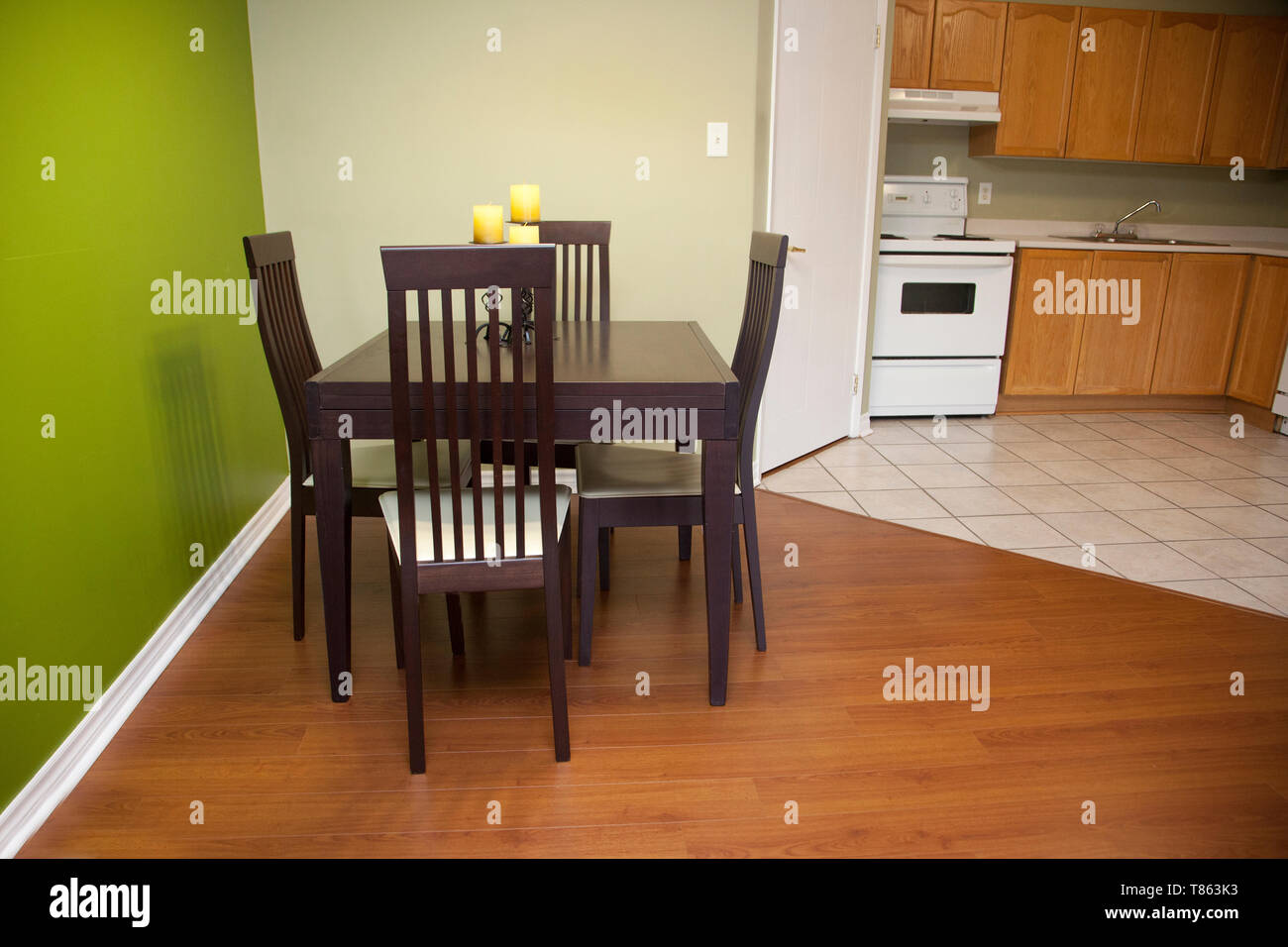 Eating area with kitchen stove in the background Stock Photo