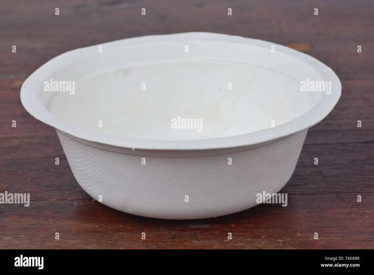 Disposable bowl on wood background Stock Photo