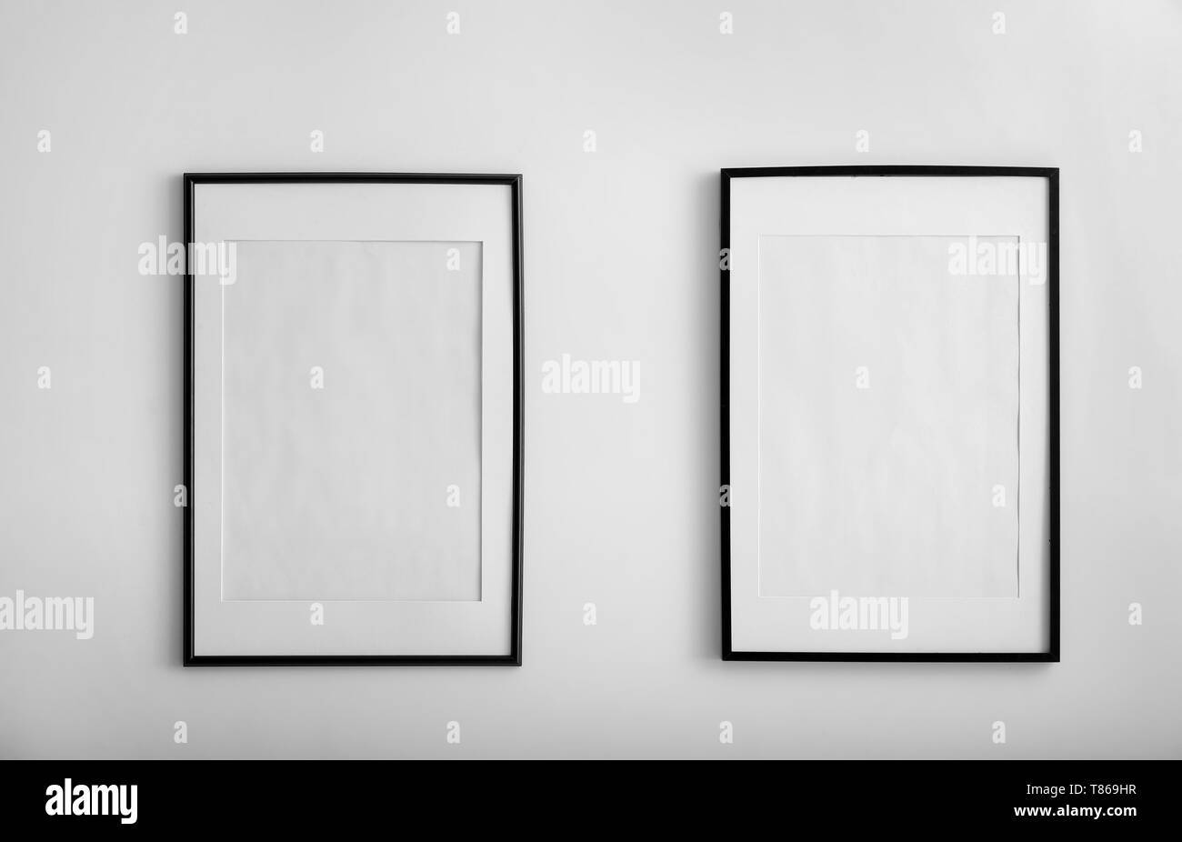 Blank frames hanging on Black and White Stock Photos & Images - Alamy