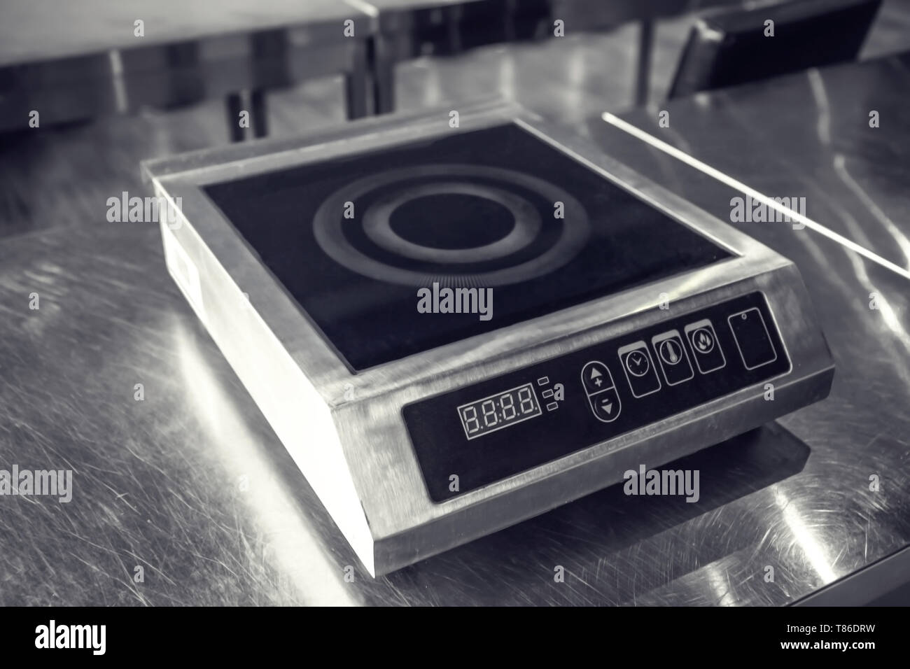 Induction cooker in restaurant kitchen Stock Photo Alamy