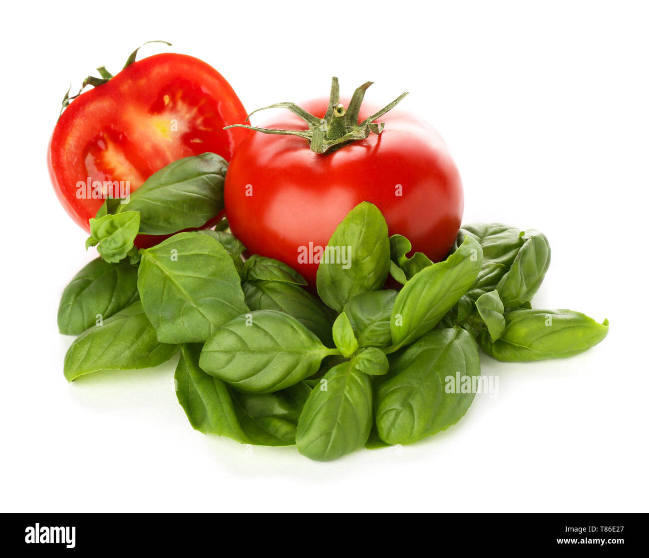 Fresh basil and tomatoes on white background Stock Photo - Alamy