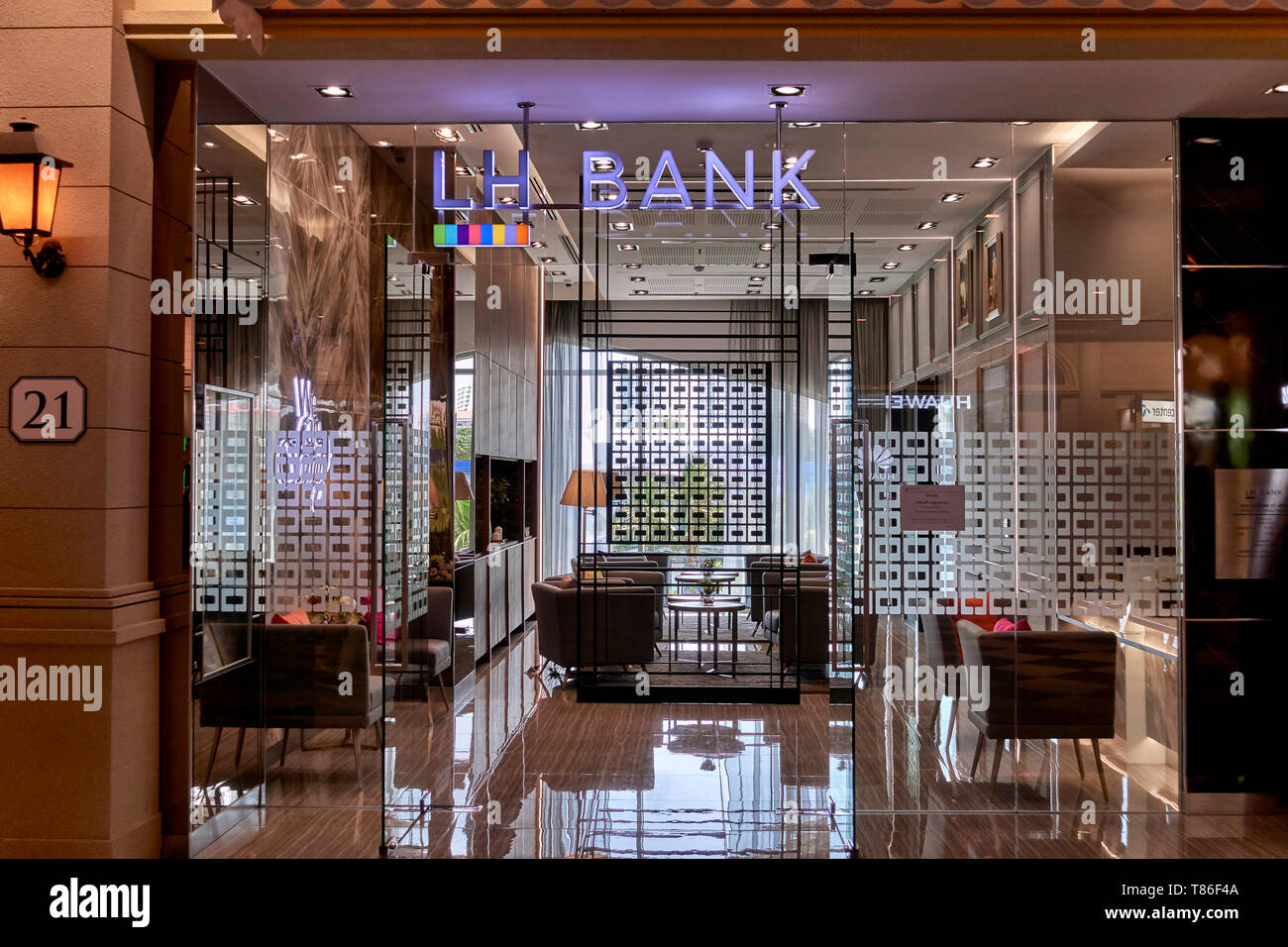 Modern interior architecture. Glass fronted reception area and glass door entrance of the LH Bank Thailand Southeast Asia Stock Photo