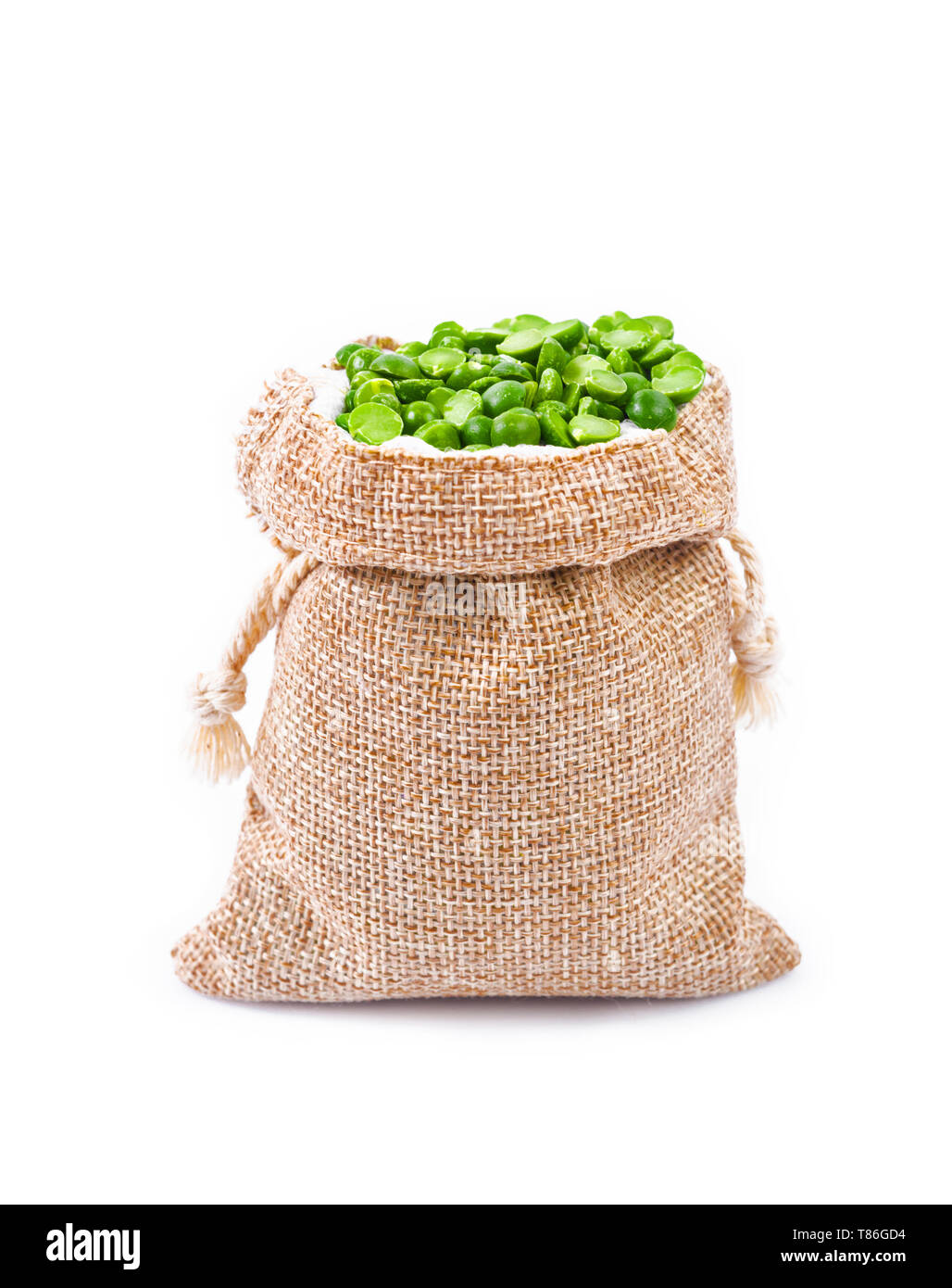 organic green split peas filling in sack bag isolated on a white ...