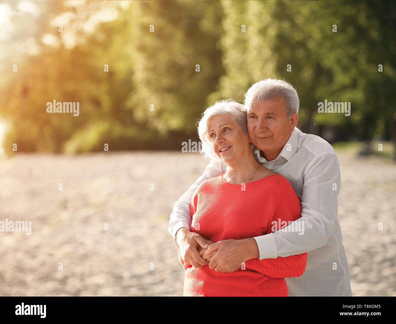 Happy mature couple on beach hi-res stock photography and images - Alamy