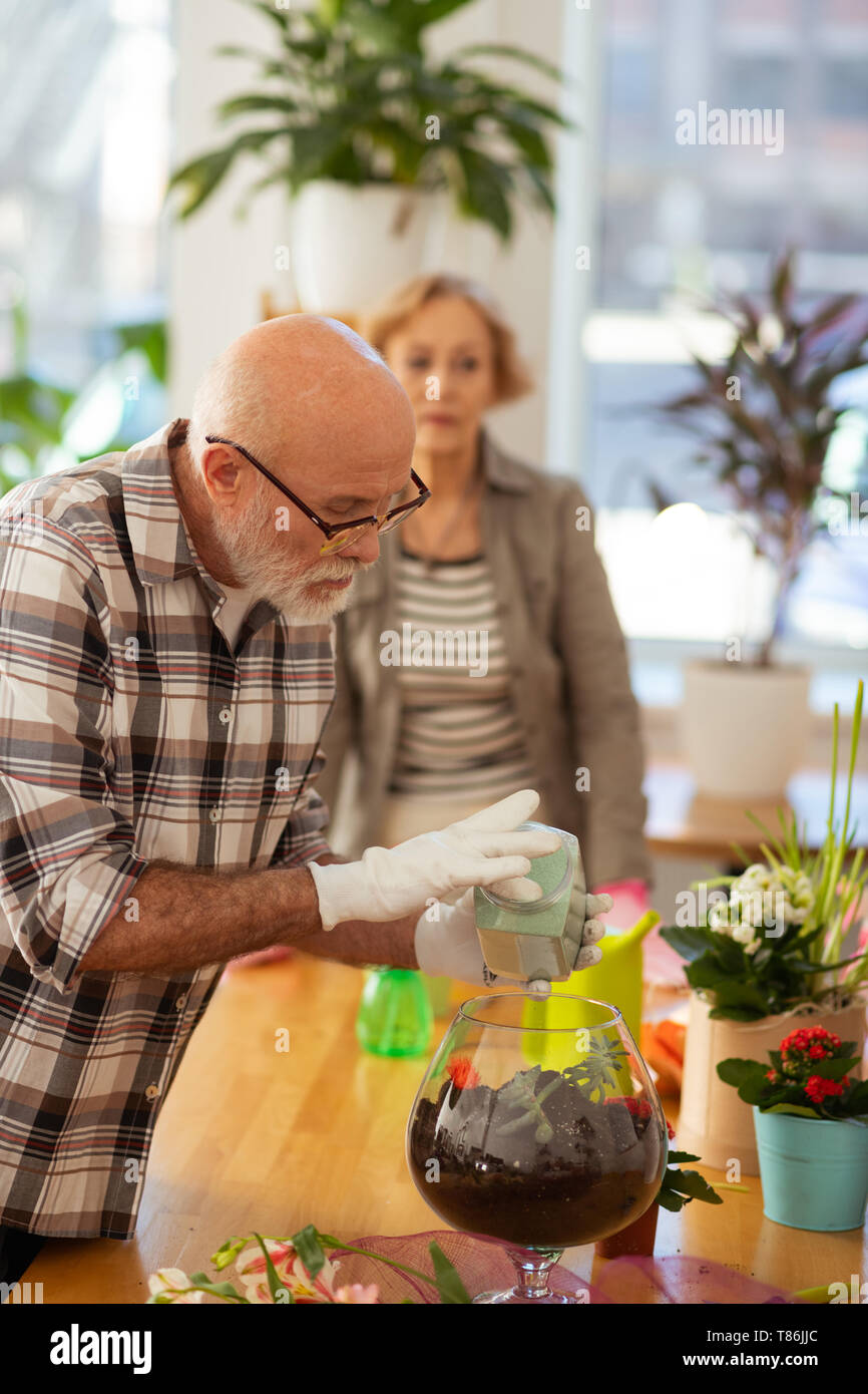 Nice good looking aged man focusing on his work Stock Photo