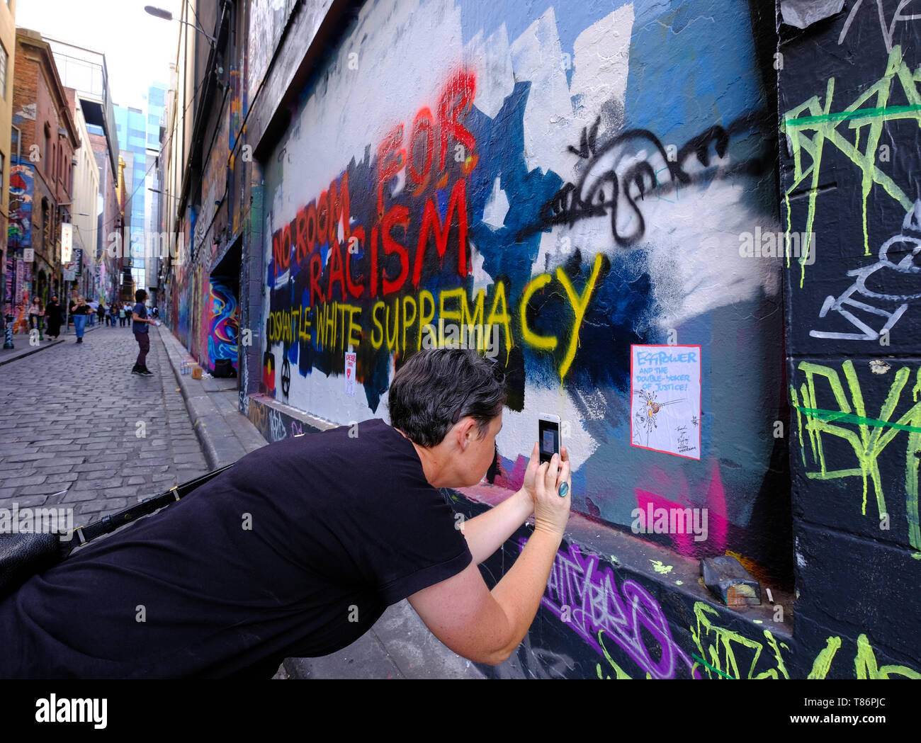 The mural honouring 'Egg Boy' Will Connolly who smashed an egg on Fraser Anning's head was painted over with an anti-racism message a few days later. Stock Photo