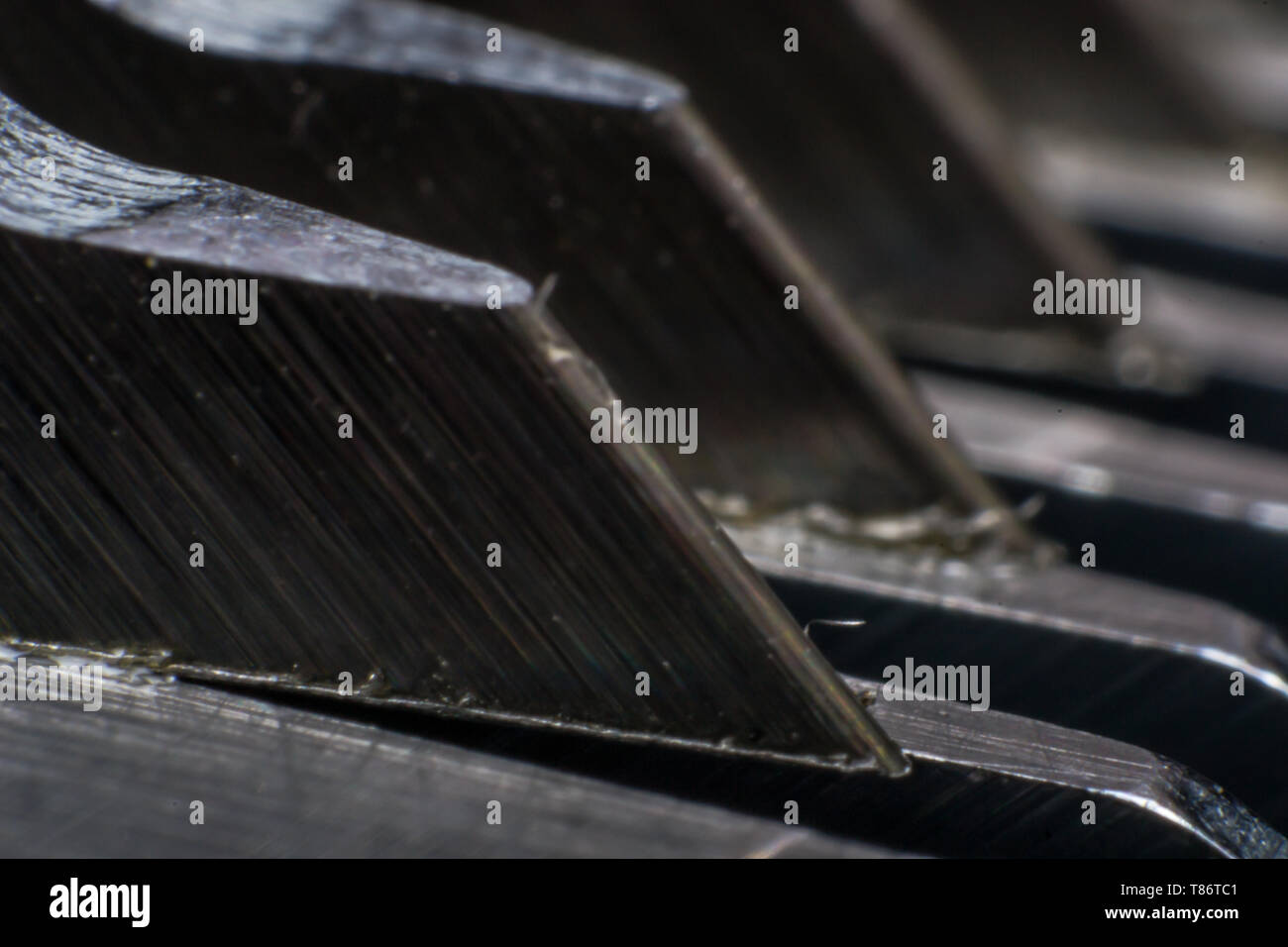 extreme macro photo of a trimming blade, Oster blade Stock Photo - Alamy