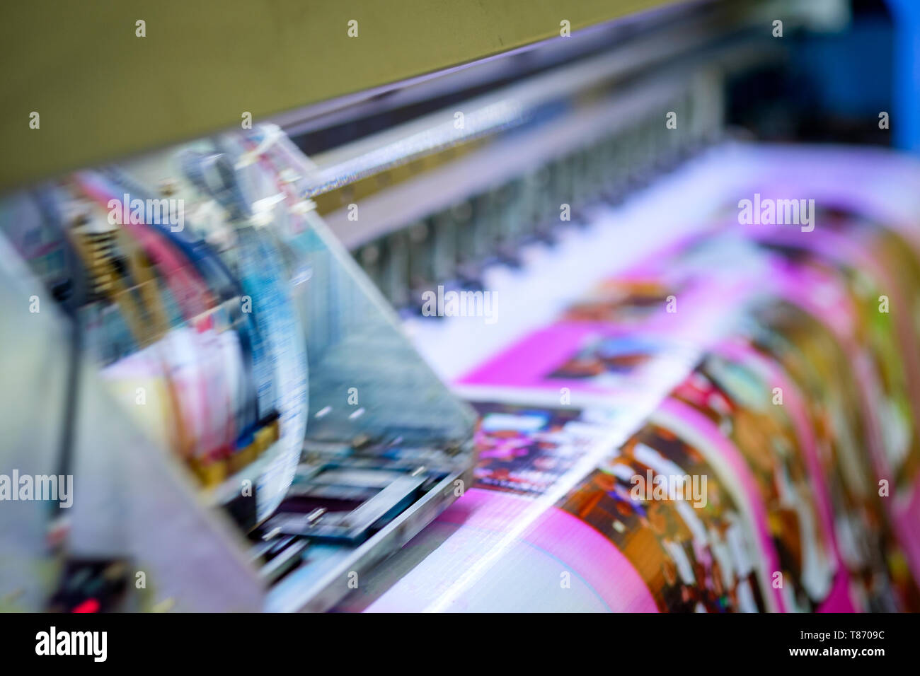 Head inkjet during printing on pink vinyl banner Stock Photo