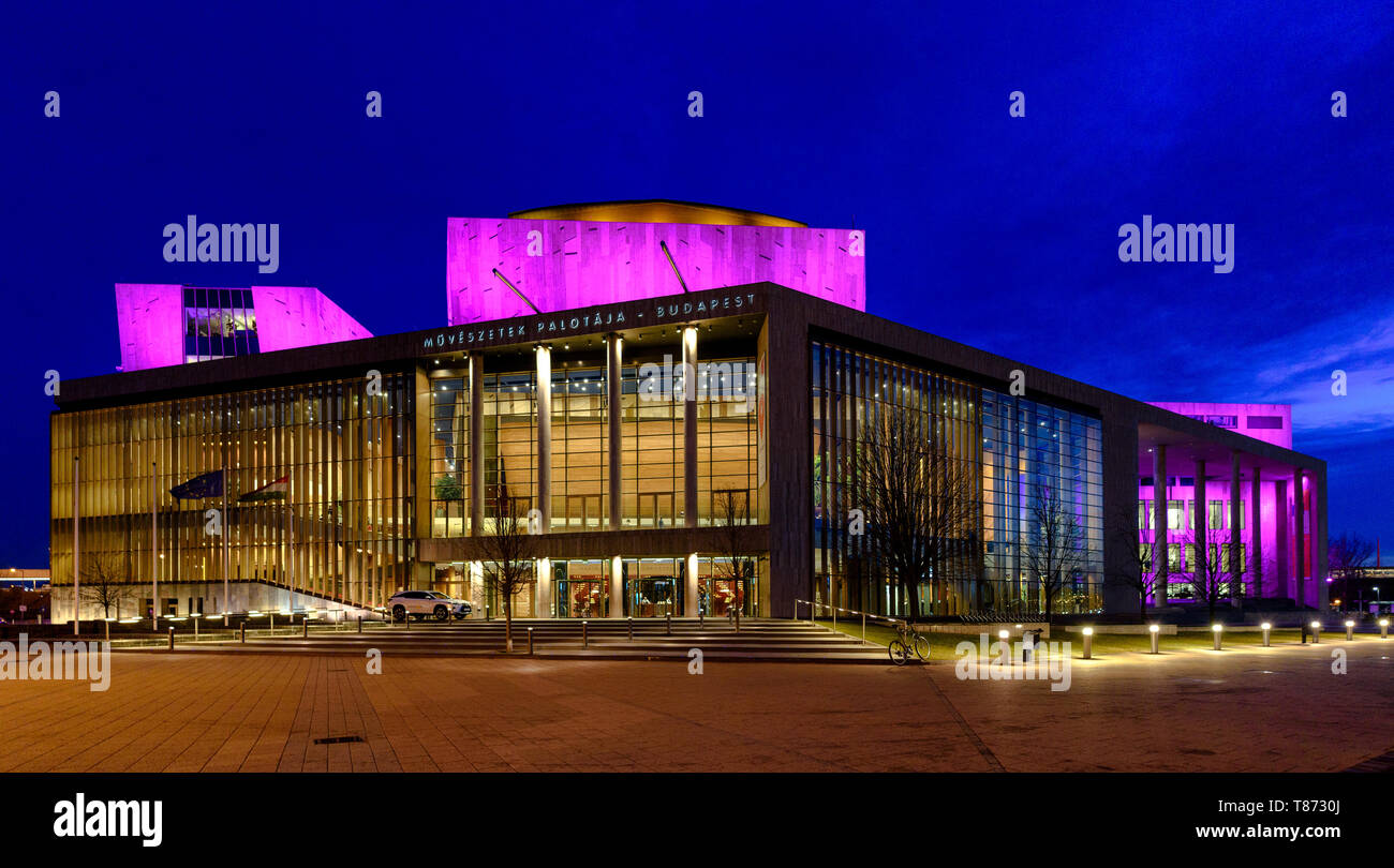 The Müpa Budapest performing arts centre with the lights on in the evening Stock Photo
