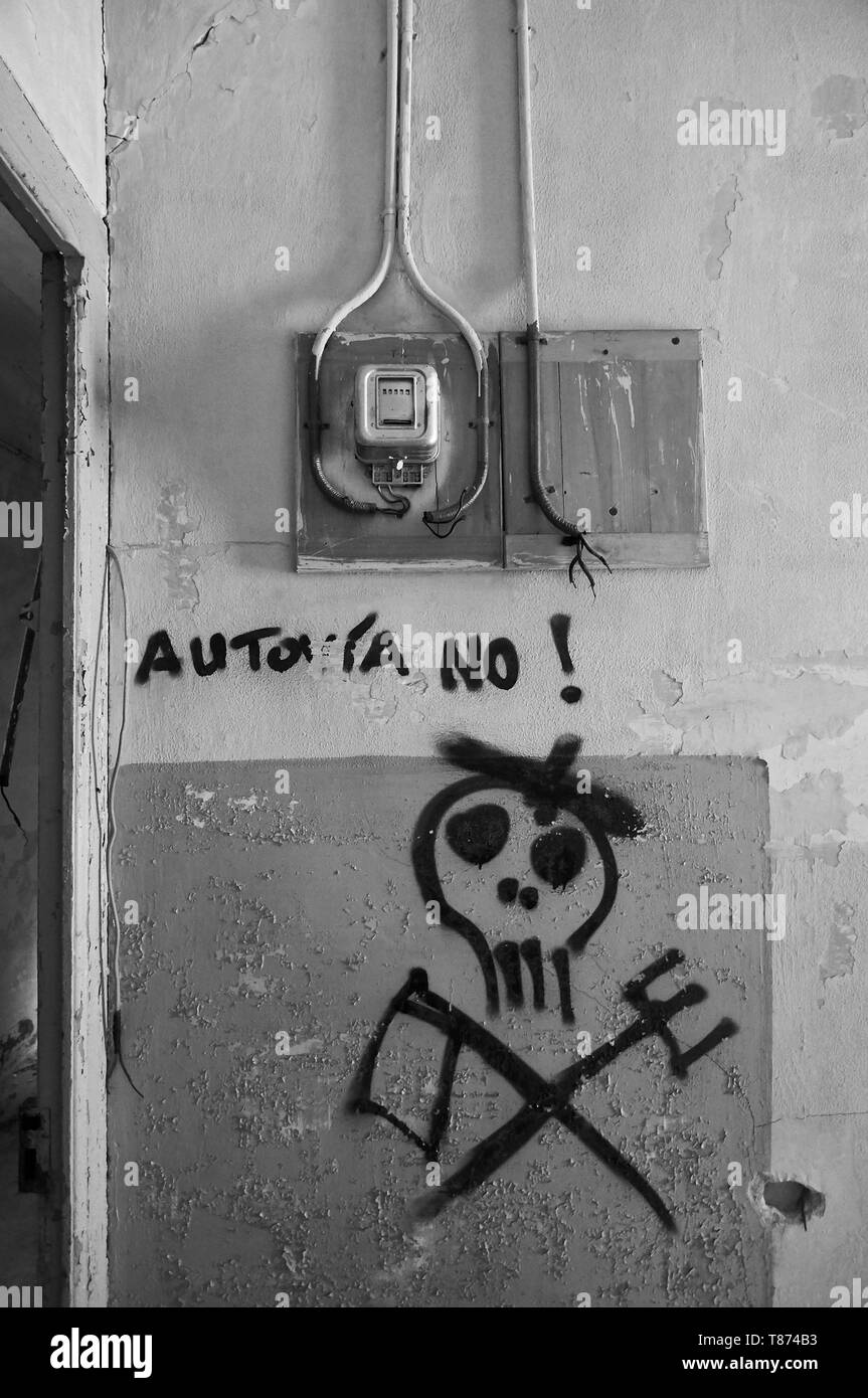 Interior of ruined facilities covered by graffiti at the Canfranc International railway station (Canfranc, Pyrenees, Huesca, Aragon,Spain) B&W version Stock Photo