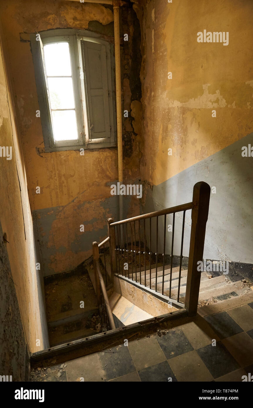 Interior stairs in ruined facilities at the abandoned Canfranc International railway station (Canfranc, Pyrenees, Huesca, Aragon, Spain) Stock Photo